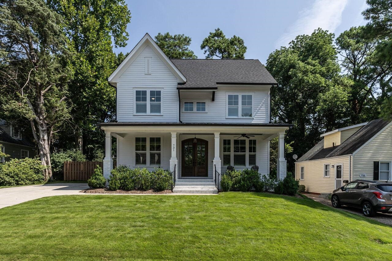 731 New Road Raleigh, NC 27608 - Photo 1 of 28 a front view of a house with a garden