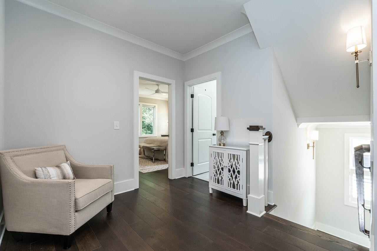 731 New Road Raleigh, NC 27608 - Photo 17 of 28 a living room with furniture and wooden floor