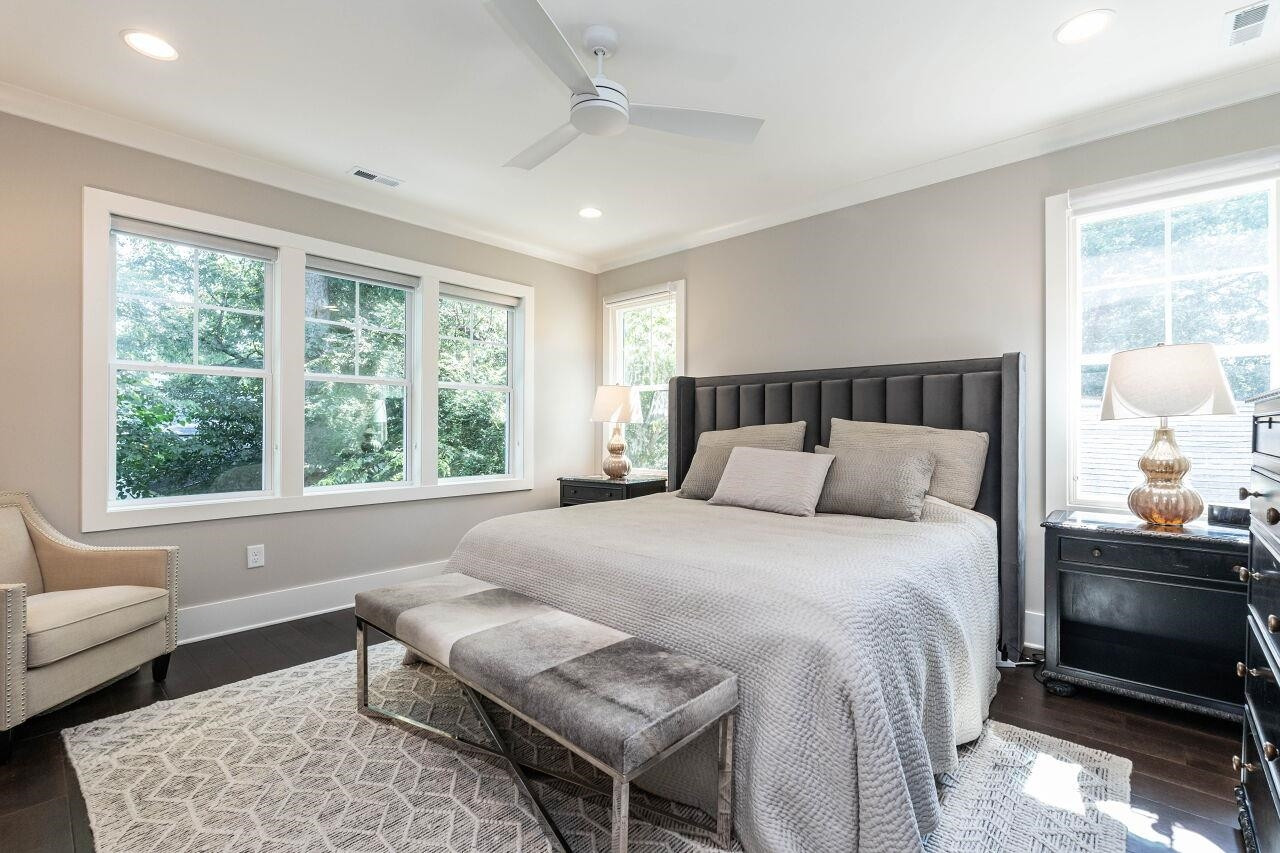 731 New Road Raleigh, NC 27608 - Photo 18 of 28 a bedroom with a bed and wooden floor