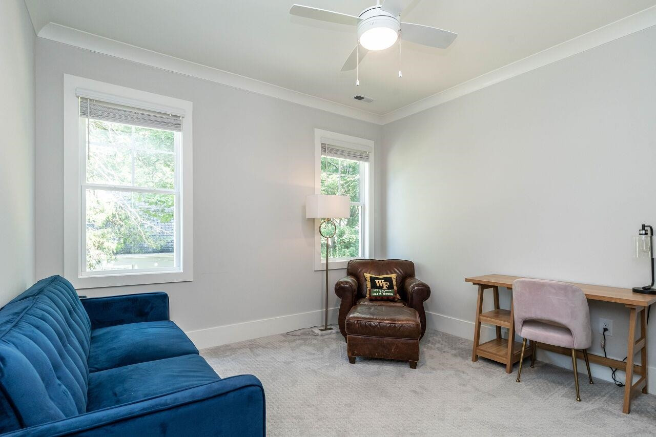 731 New Road Raleigh, NC 27608 - Photo 21 of 28 a living room with furniture and a window