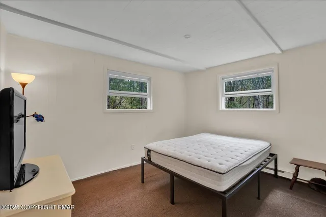 a view of a room that has a couch and a table in it