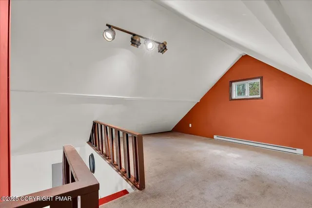 a view of an empty room with stairs