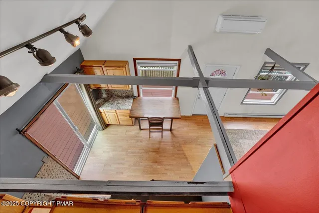 a view of living room with furniture and white walls