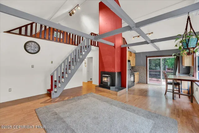 a view of entryway dining room and hall with wooden floor