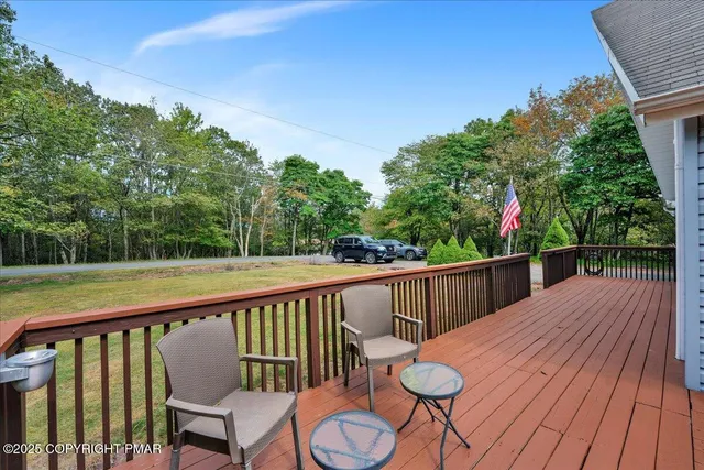 a view of a two chairs in the balcony