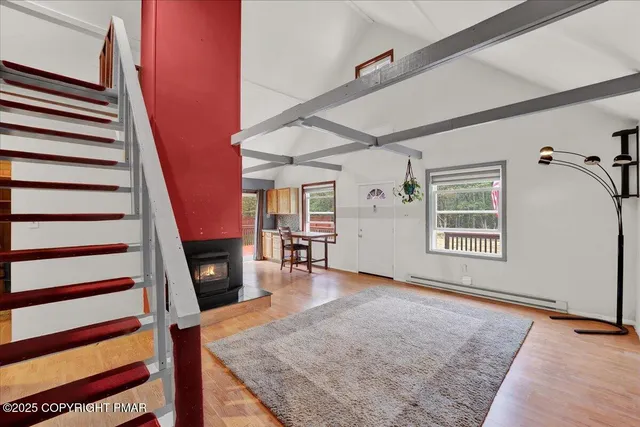 wooden floor in an empty room with a fireplace