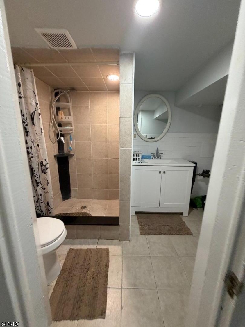 746 Murray Street, Unit 1 Elizabeth, NJ 07202 - Photo 21 of 28 a bathroom with a sink toilet and shower