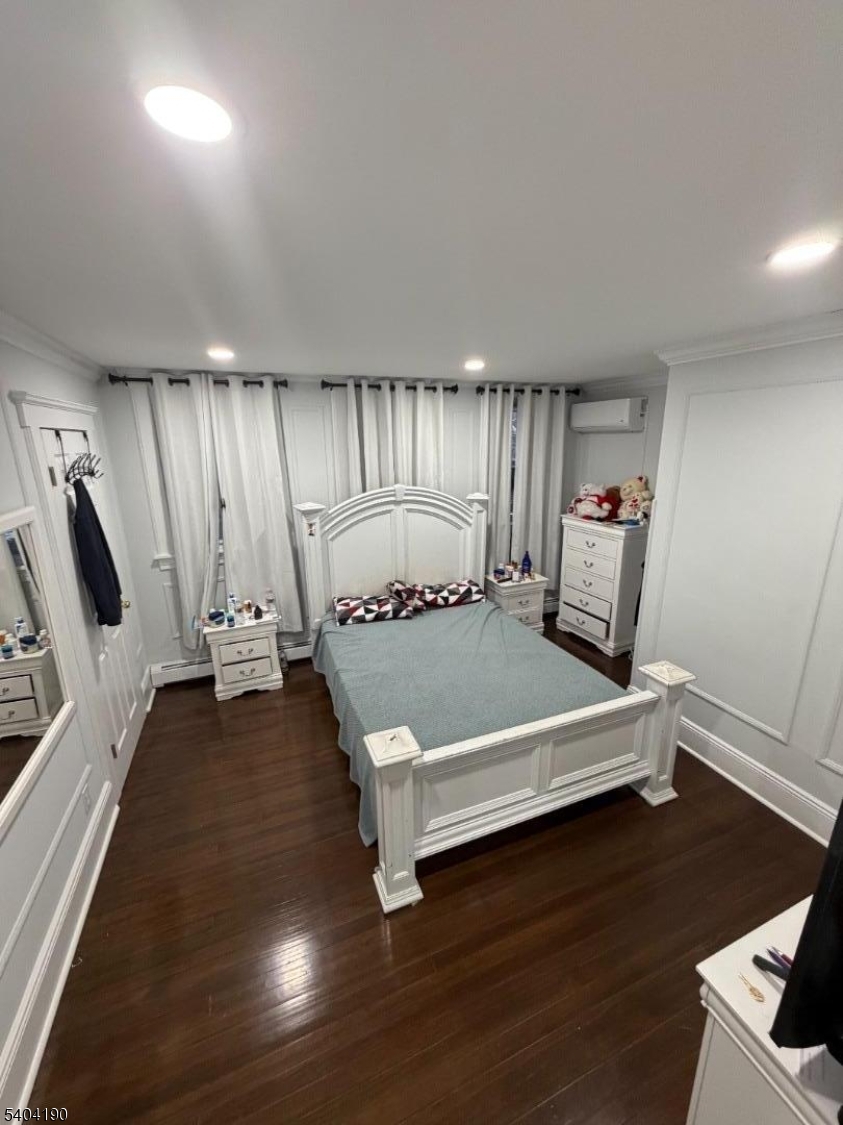 746 Murray Street, Unit 1 Elizabeth, NJ 07202 - Photo 24 of 28 a view of a room with wooden floor and furniture