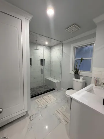 a bedroom with a bed and a television