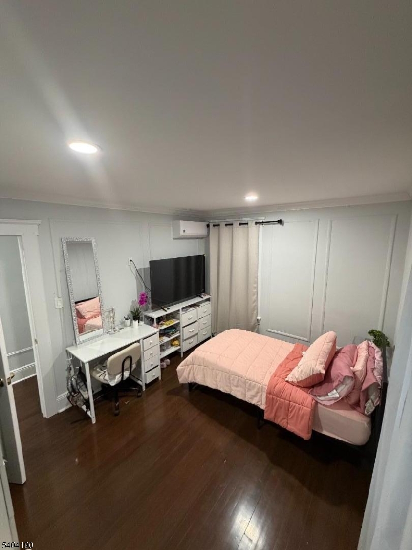 746 Murray Street, Unit 1 Elizabeth, NJ 07202 - Photo 28 of 28 a bedroom with a bed and a television