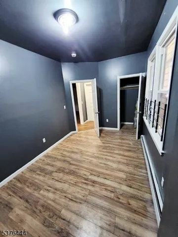 a view of a livingroom with wooden floor