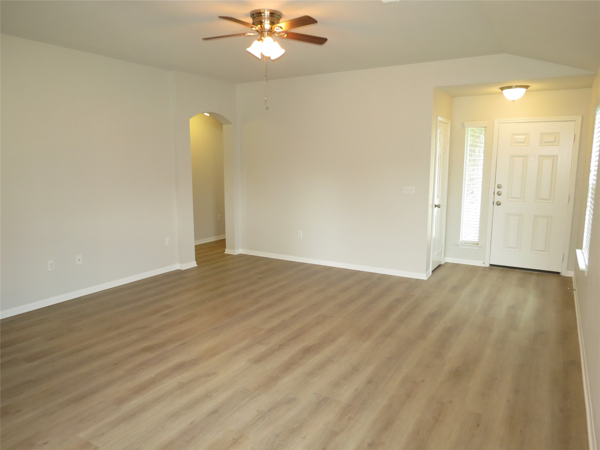 375 Musgrav Kyle, TX 78640 - Photo 5 of 31 Open living room with fresh flooring invites you into this well-lit space.