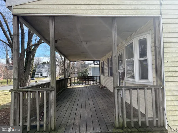 a view of balcony with wooden floor