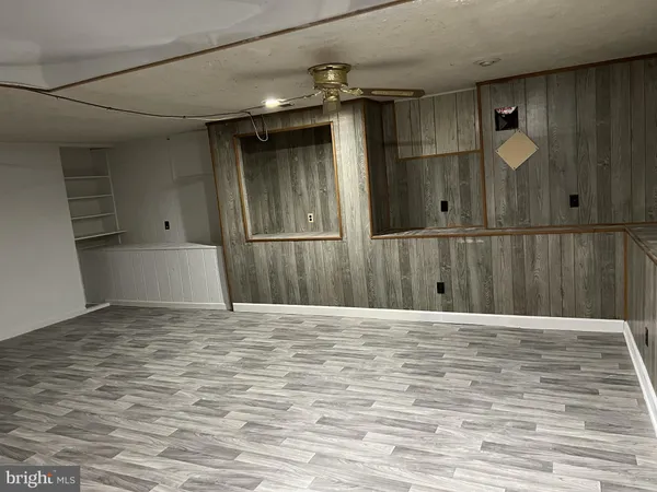 a view of porch with wooden floor