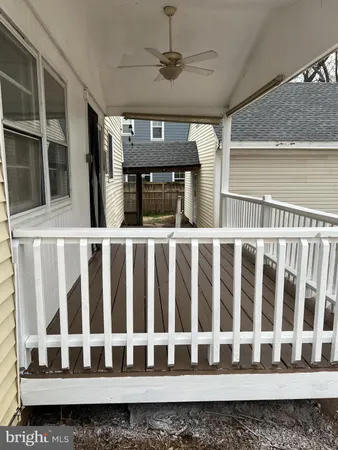 a view of a balcony with wooden floor