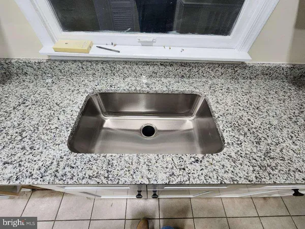 a bathroom with a toilet a sink and bathtub