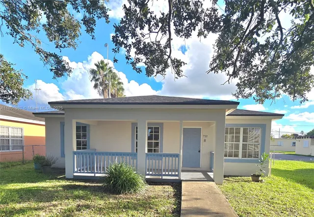 front view of a house with a yard