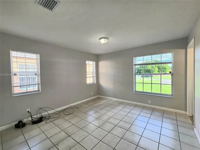a view of an empty room and window