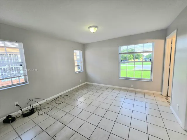 a view of an empty room and window