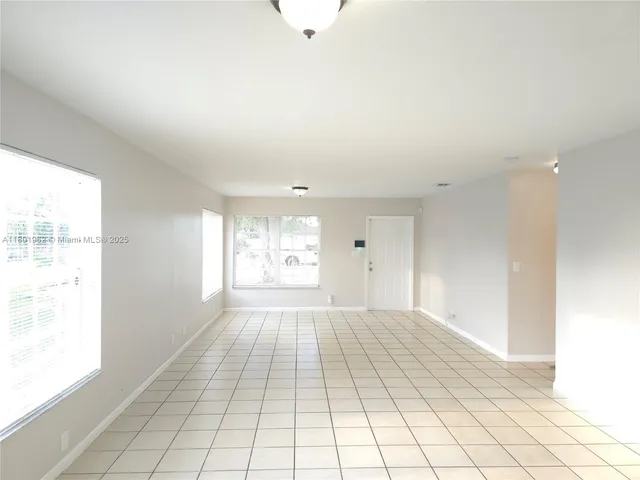 a view of an empty room and window