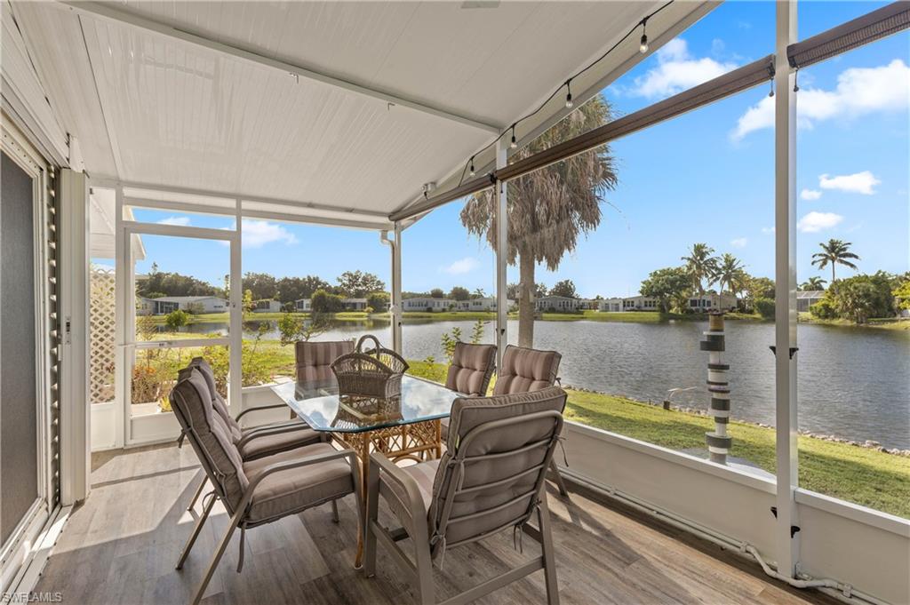 265 Riverwood Road Naples, FL 34114 - Photo 17 of 31 a dining room with a table and chairs