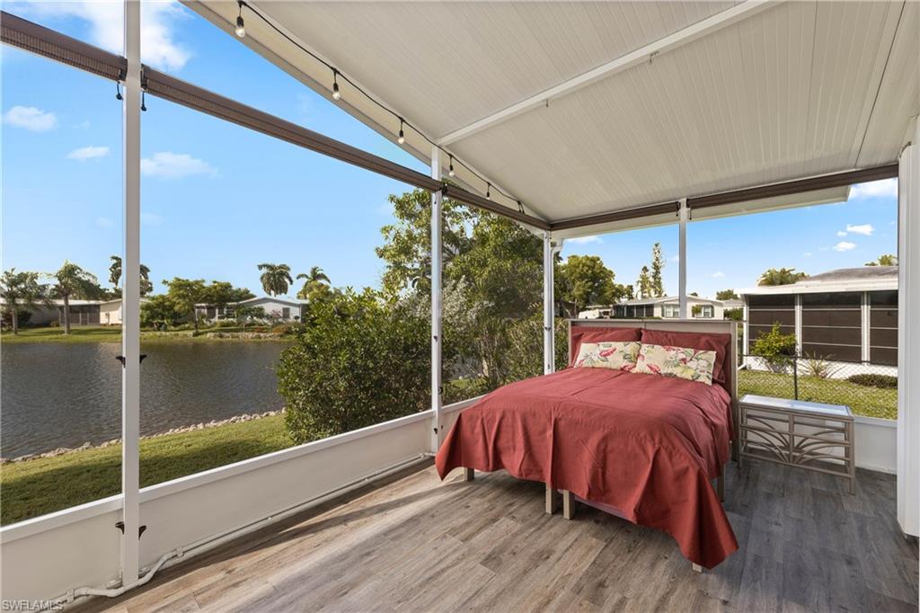 265 Riverwood Road Naples, FL 34114 - Photo 18 of 31 a view of a balcony with table and chairs