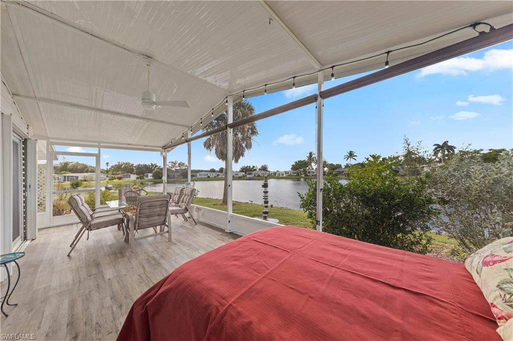 265 Riverwood Road Naples, FL 34114 - Photo 19 of 31 a patio with table and chairs