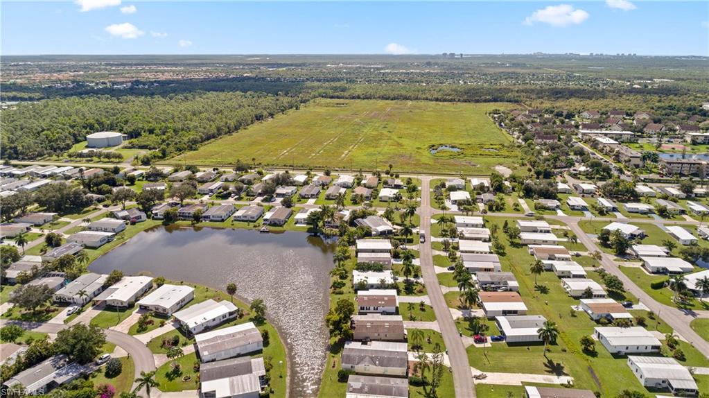 265 Riverwood Road Naples, FL 34114 - Photo 30 of 31 an aerial view of residential houses with outdoor space