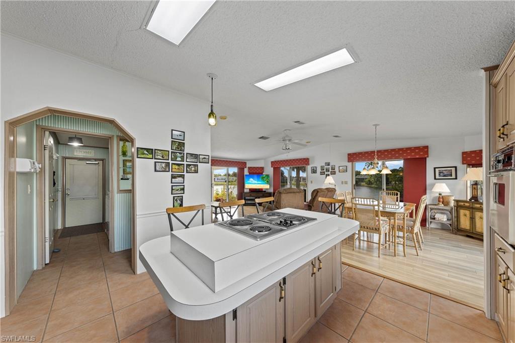 265 Riverwood Road Naples, FL 34114 - Photo 6 of 31 a view of a dining room kitchen and a livingroom
