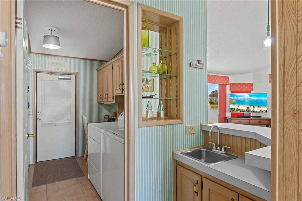 265 Riverwood Road Naples, FL 34114 - Photo 9 of 31 a room with storage and utility