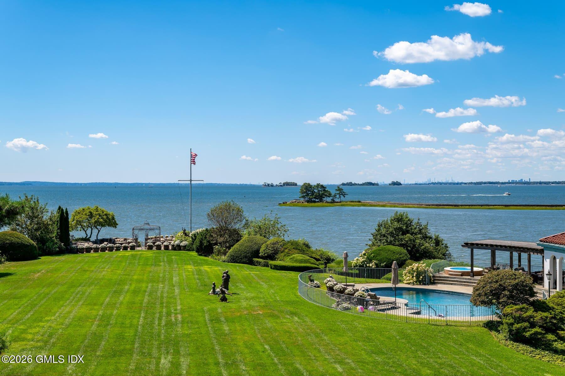 108 Cedar Cliff Road Riverside, CT 06878 - Photo 41 of 49 a view of a lake with a garden