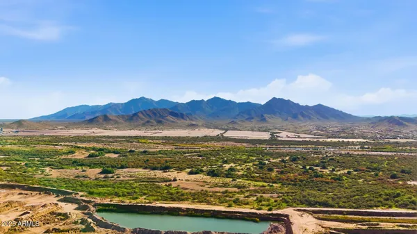 a view of an ocean with a mountain