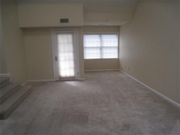 663 Lowell Street, Unit 37 Lexington, MA 02420 - Photo 3 of 13 an empty room with a window