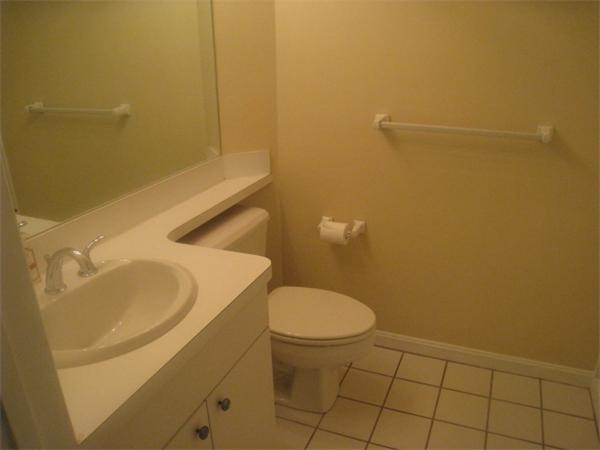 663 Lowell Street, Unit 37 Lexington, MA 02420 - Photo 5 of 13 a bathroom with a sink and a toilet