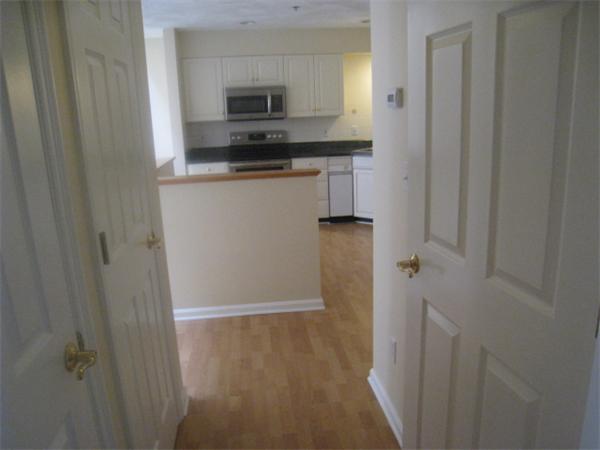663 Lowell Street, Unit 37 Lexington, MA 02420 - Photo 6 of 13 a kitchen with stainless steel appliances a refrigerator and a sink
