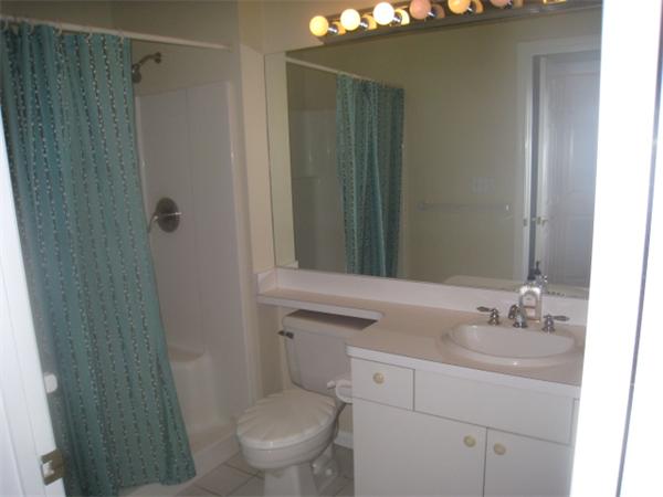 663 Lowell Street, Unit 37 Lexington, MA 02420 - Photo 8 of 13 a bathroom with a sink a toilet and shower