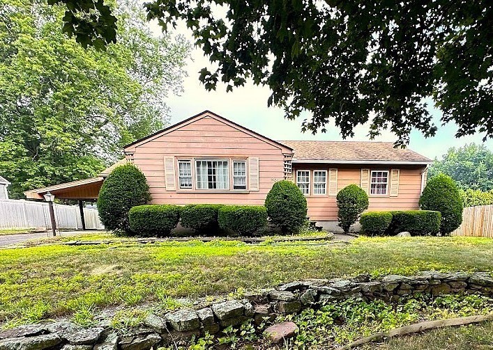 208 Roy Street Springfield, MA 01104 - Photo 1 of 15 a front view of a house with garden