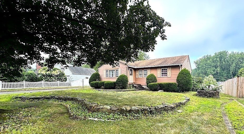 208 Roy Street Springfield, MA 01104 - Photo 2 of 15 a front view of a house with a yard