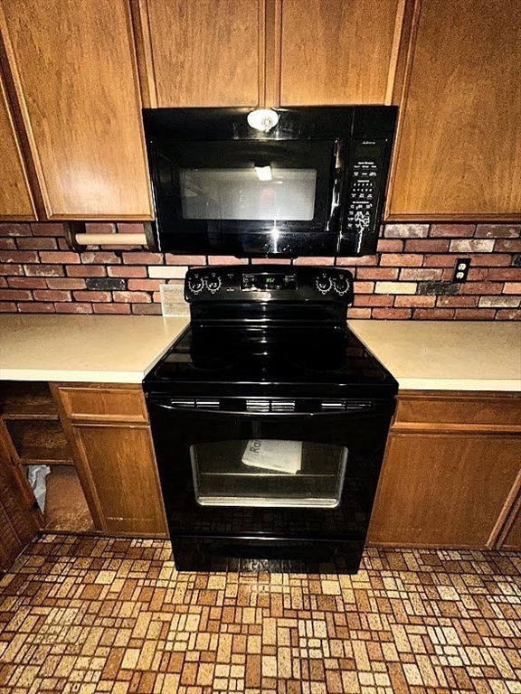 208 Roy Street Springfield, MA 01104 - Photo 4 of 15 a stove top oven sitting inside of a kitchen
