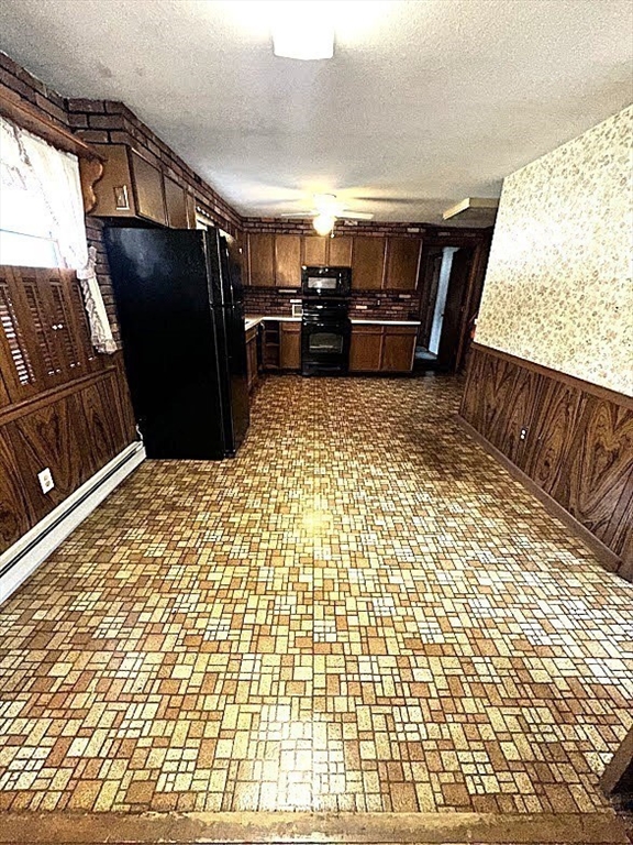 208 Roy Street Springfield, MA 01104 - Photo 5 of 15 a view of kitchen with furniture and a refrigerator
