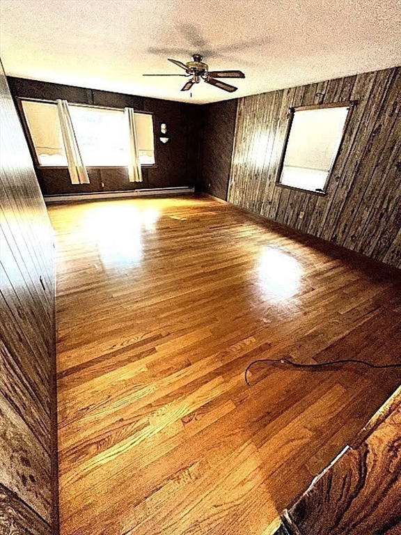 208 Roy Street Springfield, MA 01104 - Photo 8 of 15 a view of an empty room with wooden floor