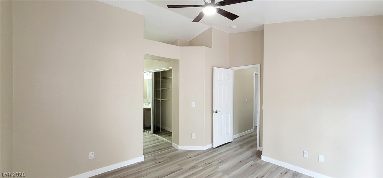 19 Rue De Parc Henderson, NV 89074 - Photo 8 of 23 Vaulted ceilings and plank flooring create a light, airy ambiance in this master suite.