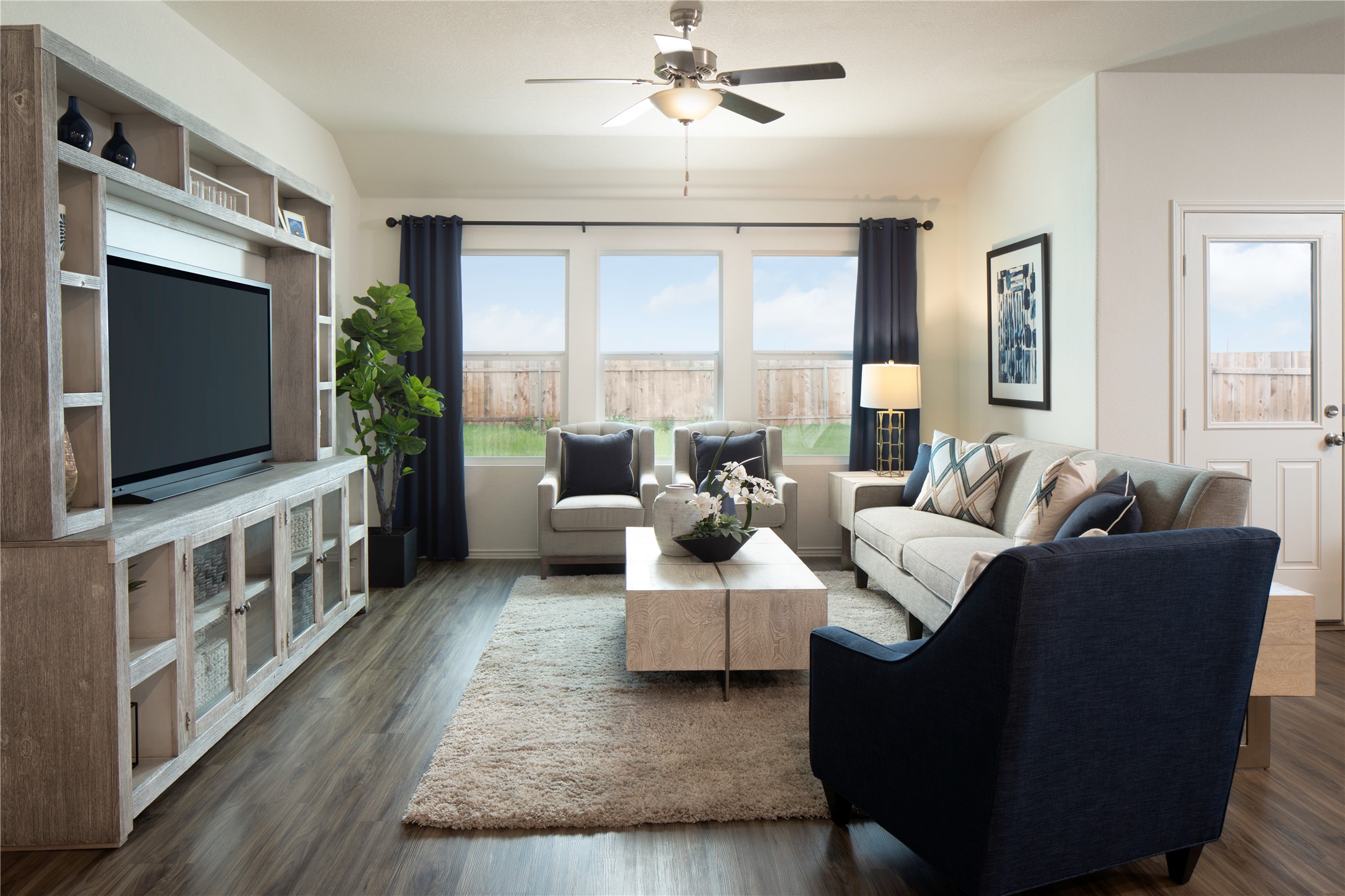 129 Arbordale Street Georgetown, TX 78628 - Photo 11 of 18 a living room with furniture and a flat screen tv