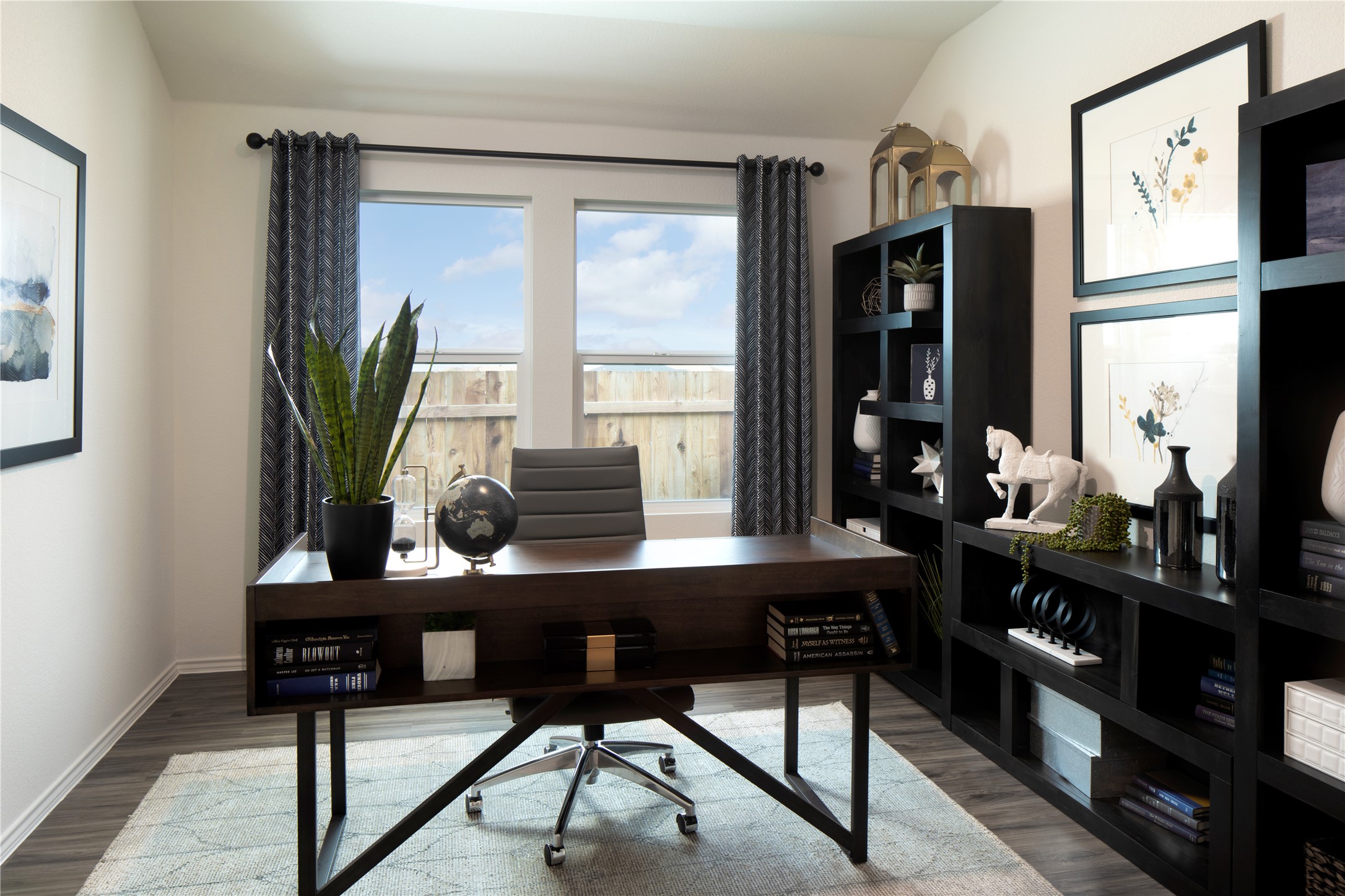 129 Arbordale Street Georgetown, TX 78628 - Photo 13 of 18 a view of a workspace with furniture and a potted plant