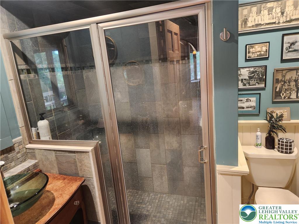 861 Municipal Road Walnutport, PA 18088 - Photo 16 of 94 a bathroom with a sink and glass door