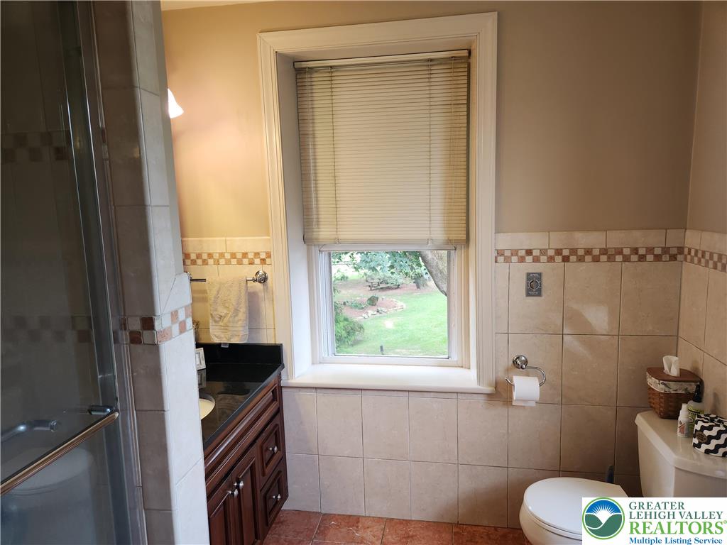 861 Municipal Road Walnutport, PA 18088 - Photo 42 of 94 a bathroom with a toilet a sink and a window