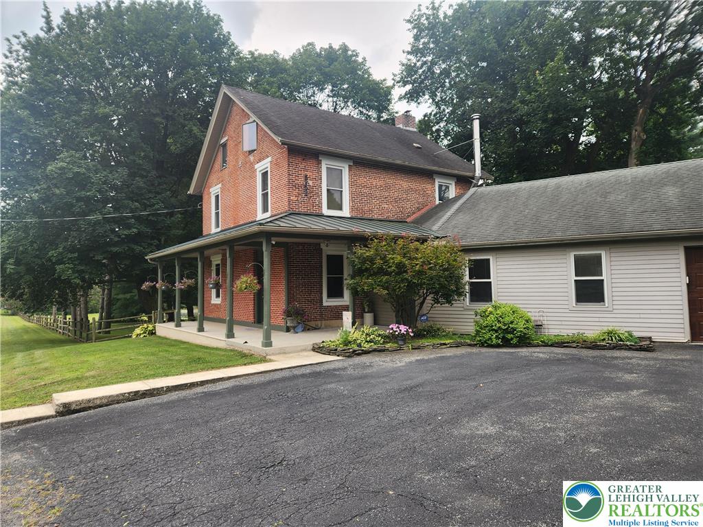 861 Municipal Road Walnutport, PA 18088 - Photo 51 of 94 a front view of a house with a yard and garage