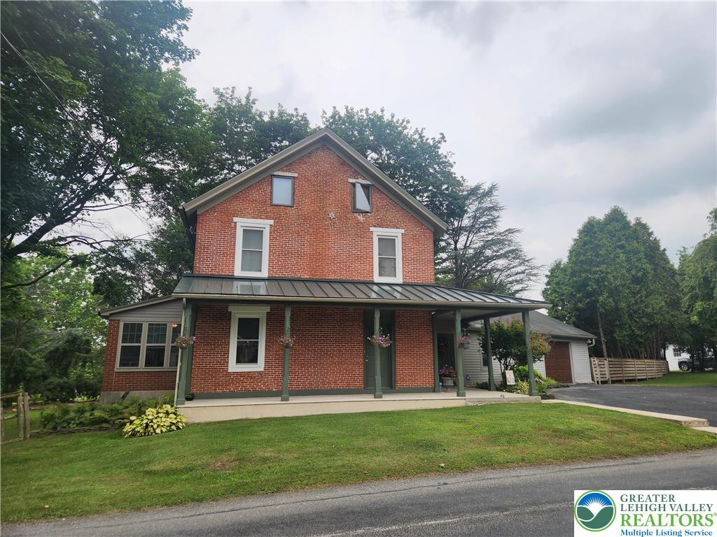 861 Municipal Road Walnutport, PA 18088 - Photo 55 of 94 a front view of a house with a garden