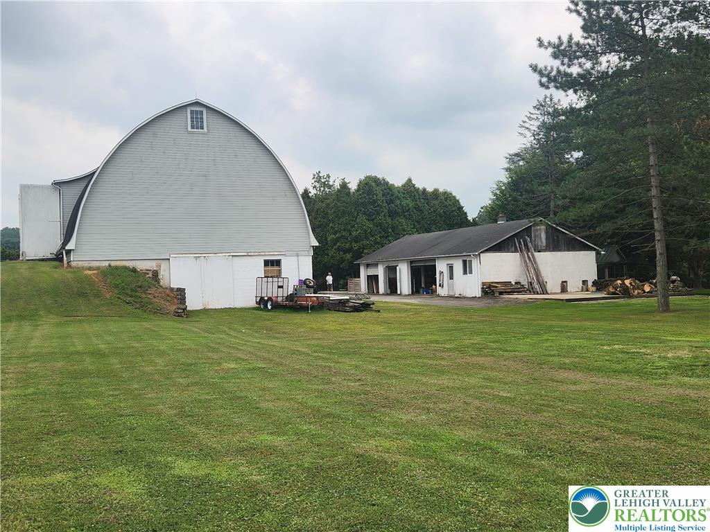 861 Municipal Road Walnutport, PA 18088 - Photo 66 of 94 a front view of house with yard and trees in the background