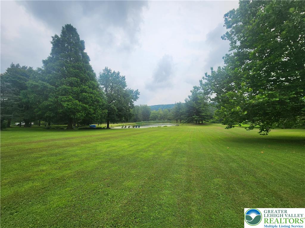 861 Municipal Road Walnutport, PA 18088 - Photo 72 of 94 a view of a green field with wooden fence